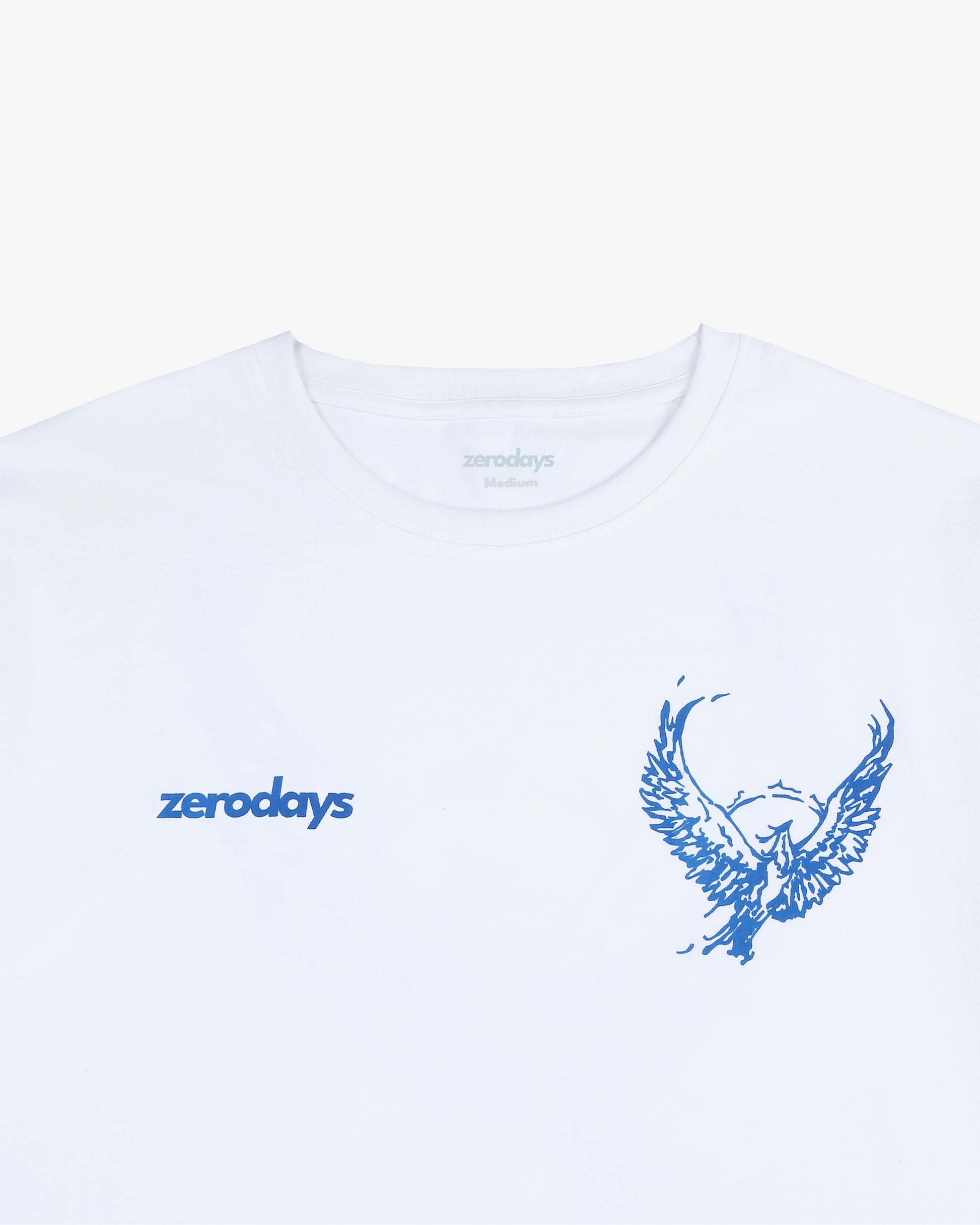  The front close-up shot of the Zerodays Phoenix T-shirt highlights the striking Zerodays logo on the left and the artistic graphic on the right. The design accentuates the vibrant blue hues against the white fabric of the t-shirt, creating a visually appealing contrast.