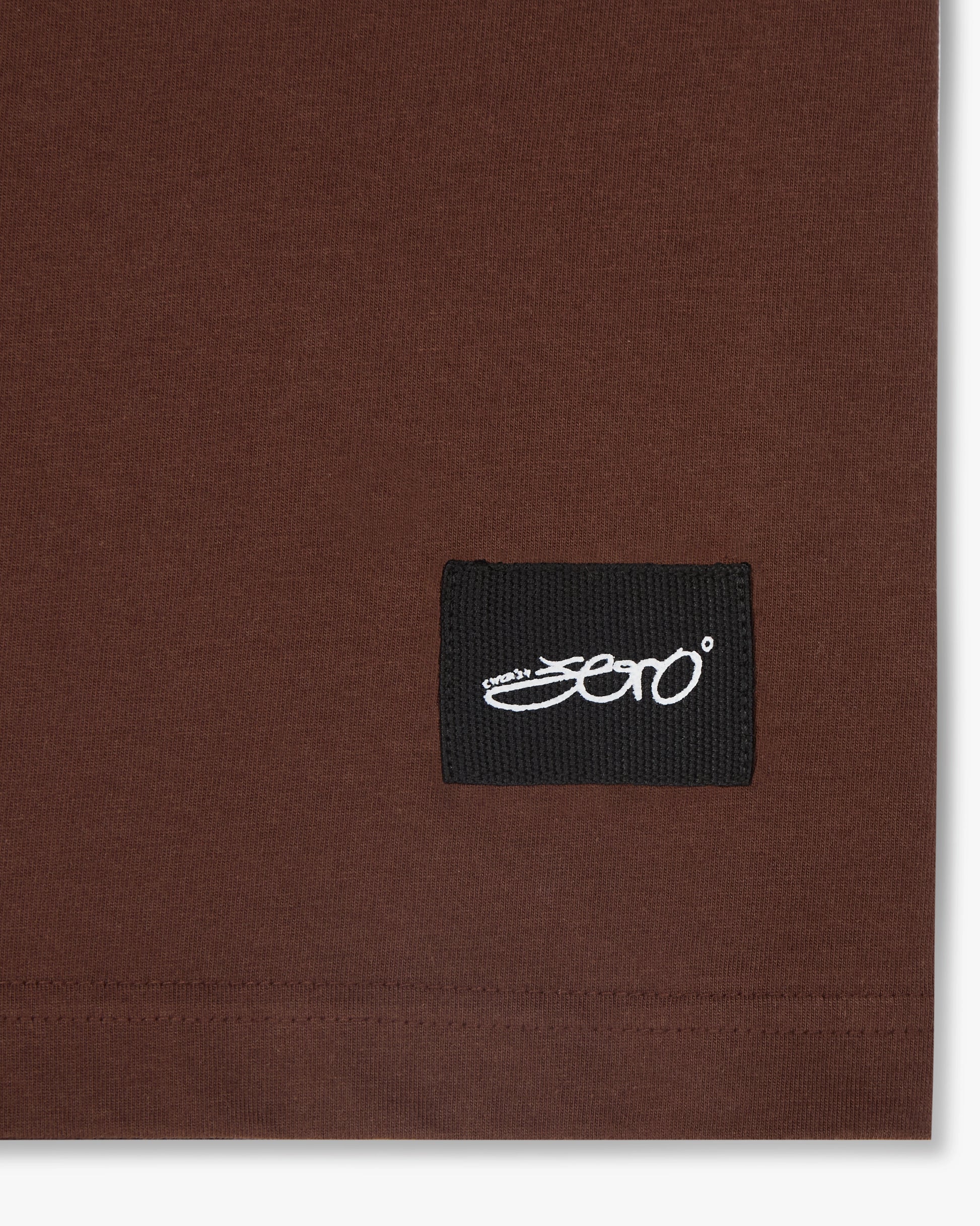 A closeup of the unique Zero tag at the bottom of the t-shirt featuring the unique zero tag. 