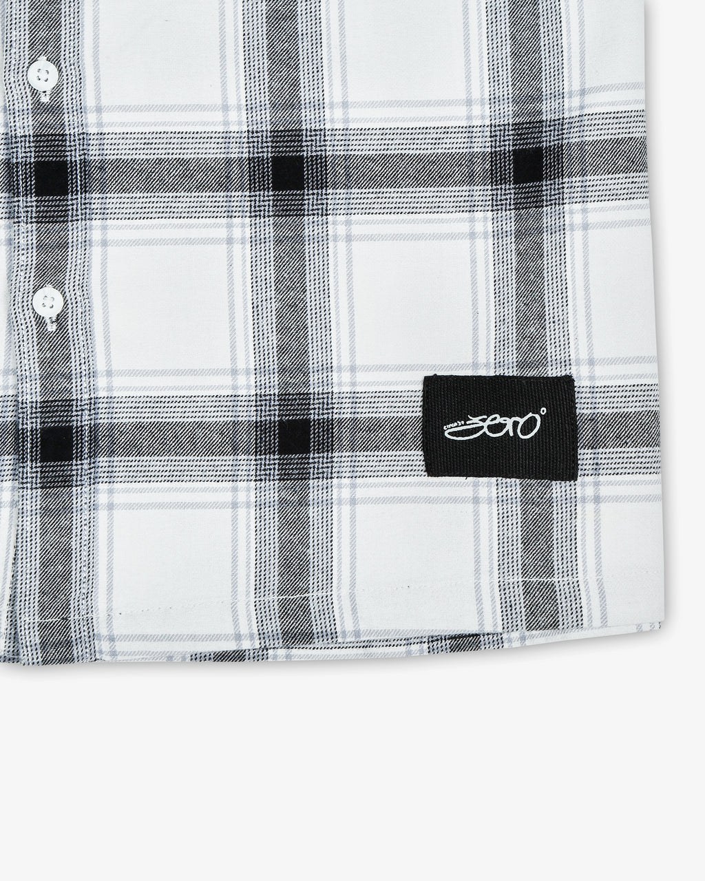A close up view of the Zerodays 'Zero' tag at the bottom of the shirt showcasing its details. 
